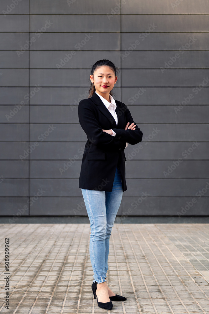 smiling successful woman entrepreneur with her arms folded, concept of entrepreneurship and business, copy space for text