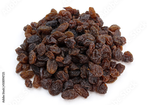 A bunch of raisins on a white background. Brown raisins close-up.