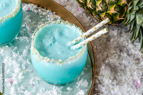 Jack Frost Christmas Cocktail with coconut rum, blue curacao, coconut cream and pineapple juice