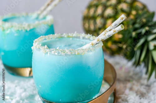 Jack Frost Christmas Cocktail with coconut rum, blue curacao, coconut cream and pineapple juice