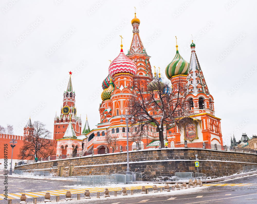 Spasskaya Tower of Moscow Kremlin and the Cathedral of Vasily the Blessed (Saint Basil's Cathedral) on Red Square. Winter morning. Moscow. Russia