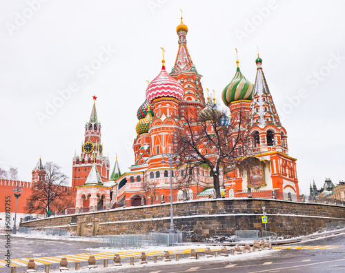 Spasskaya Tower of Moscow Kremlin and the Cathedral of Vasily the Blessed (Saint Basil's Cathedral) on Red Square. Winter morning. Moscow. Russia
