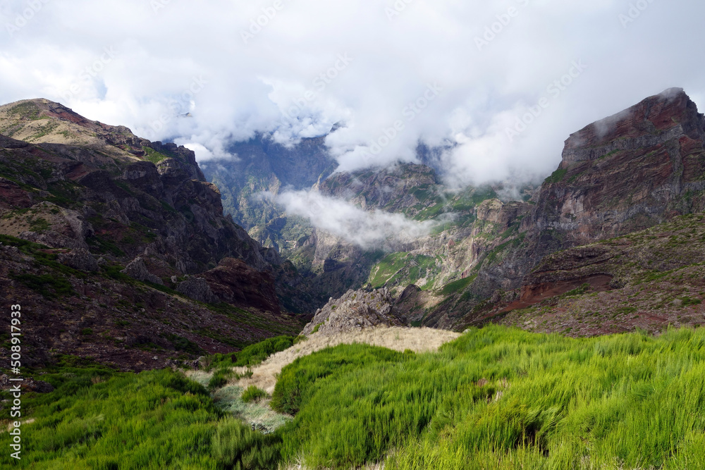 beautiful green landscape with clouds and mountains