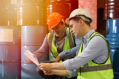 The Caucasian engineer talking and discussing in production line process after check and inspection the machine in factory, professional technician operating or work in manufacturing industrial