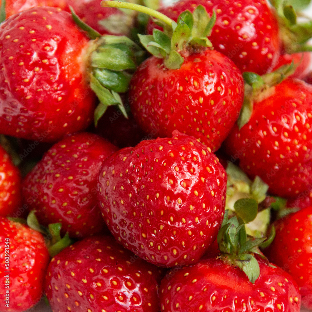Background from strawberries. Fresh ripe strawberries. Close-up. Harvest strawberries. Dessert. Background from strawberries. Fresh ripe strawberries. Close-up. Harvest strawberries. Dessert.