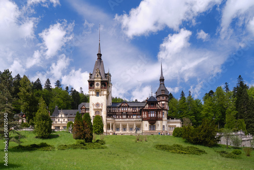 Clouds over Peles castle in Sinaia, Romania, during Spring. Popular sightseeing destination, tourism, architecture.