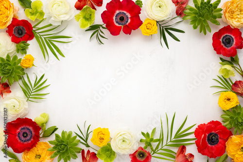 Frame flowers composition. Arrangement of anemones, roses, ranunculus, tropical flowers, succulent and leaves on light background. © Svetlana Kolpakova