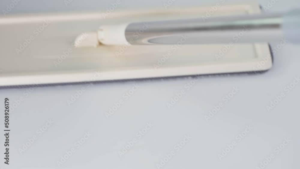 Floor mop.Bucket with self wringing mop on white background Floor mop.Bucket with self wringing mop on white background