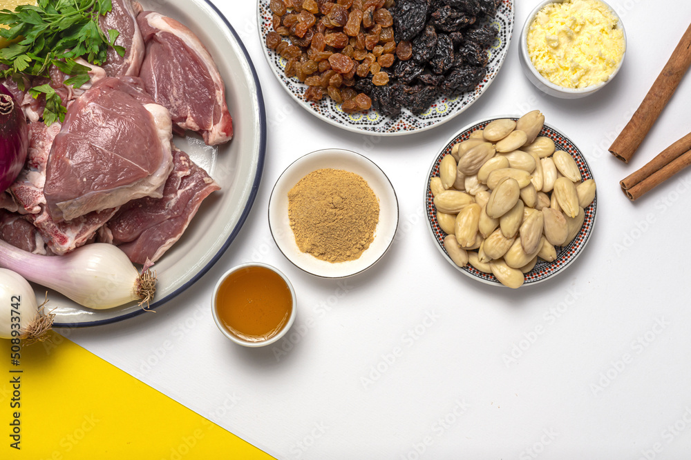 Raw ingredients and spices of traditional lamb stew or tagine Raw ingredients and spices of traditional lamb stew or tagine
