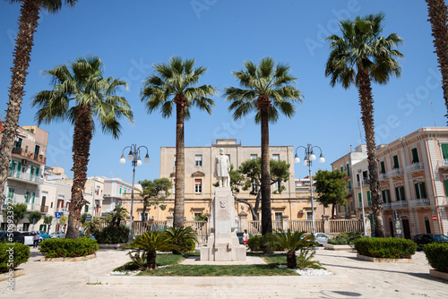 Monopoli  Italy  Apulia - May 23  2022  view of the city square with a statue 