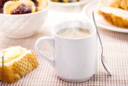 milk with coffee, traditional Brazilian breakfast drink, served hot with bread and toast