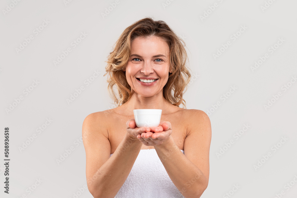 Best Cosmetics. Attractive Middle Aged Woman Holding Jar With Moisturising Cream Best Cosmetics. Attractive Middle Aged Woman Holding Jar With Moisturising Cream
