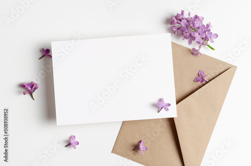 Blank wedding invitation card mockup with spring lilac flowers