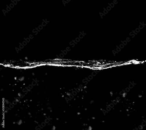 A waterline with clear water and waves on a black background. Waterline overlay effect with splashes and bubbles. photo