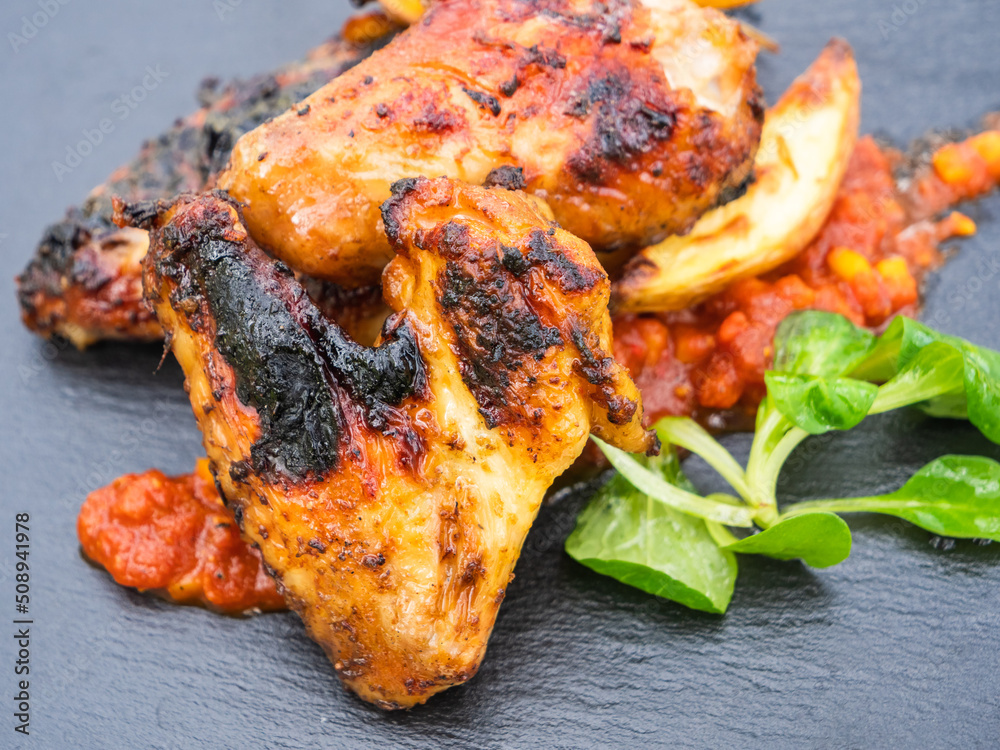 Grilled Hot Chicken Wings with Potato Wedges, a Spicy Dip and Field Salad Grilled Hot Chicken Wings with Potato Wedges, a Spicy Dip and Field Salad