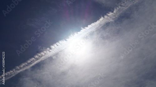 Chemical airplane contrails. Chemtrails in the sky. Airplane chemtrails in sky above Catalonia.