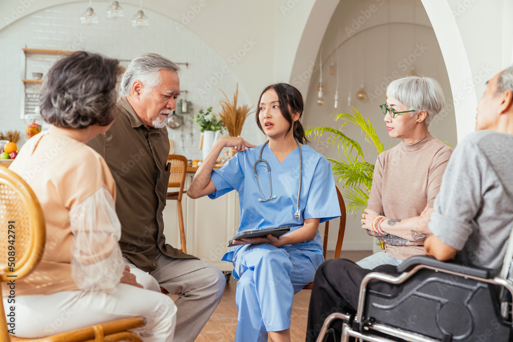 happiness Cheerful elderly woman and men talking with female caregiver nurse doctor having health checking consult at living area,Caretakers with senior couple sitting in living room at nursing home happiness Cheerful elderly woman and men talking with female caregiver nurse doctor having health checking consult at living area,Caretakers with senior couple sitting in living room at nursing home