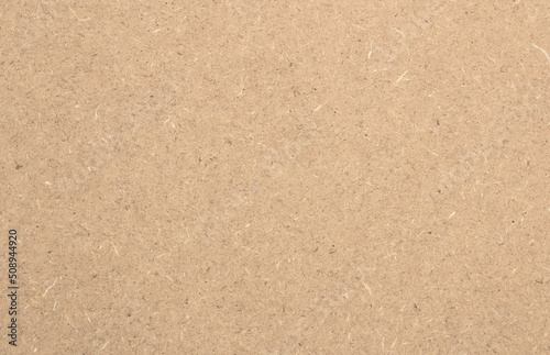 Structure and texture of raw mdf brown. Can be used as a background.