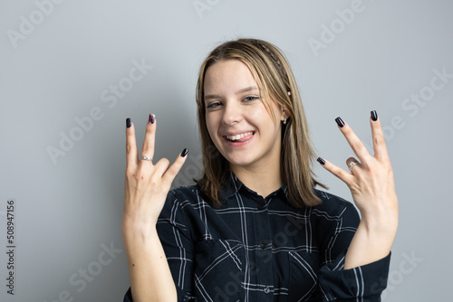 Beautiful teenager girl emotionally gesticulates
