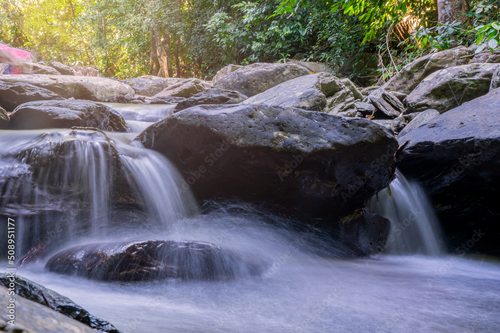 Obraz premium beautiful waterfall in rainforest at National Park, Thailand