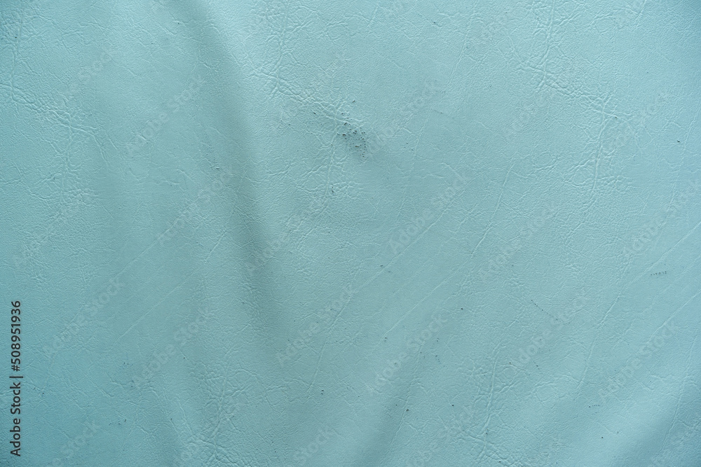 old blue leather texture and wrinkle or rough for vintage sofa or cyan pastel color fabric and blank wall or top view empty table with wave pattern for background or retro wallpaper and backdrop