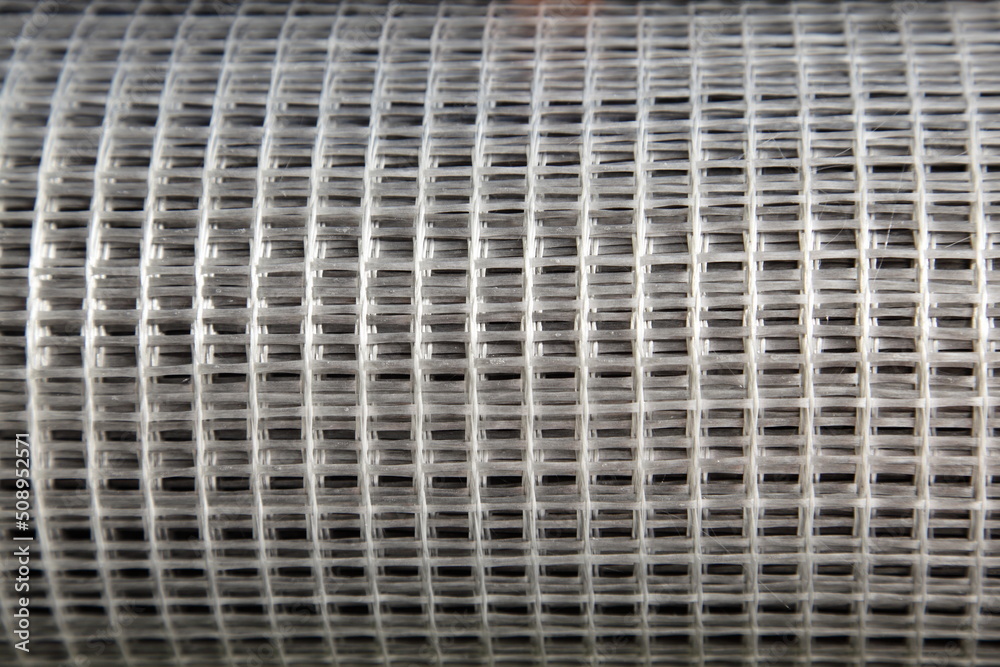 New gray fiberglass plastic splicing bars mesh reinforcement net. Building materials for concrete manufacturing.