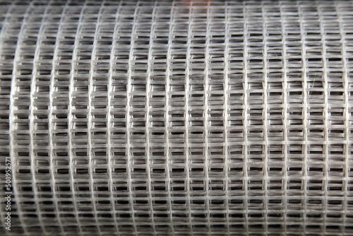 Obraz na płótnie New gray fiberglass plastic splicing bars mesh reinforcement net. Building materials for concrete manufacturing. w salonie