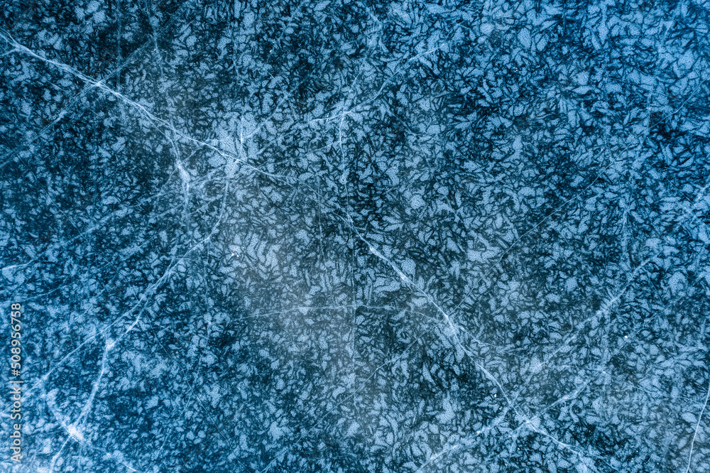 Fototapeta premium A frozen lake in the field in winter