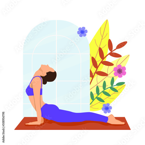 A woman doing yoga exercises, with Cobra pose.