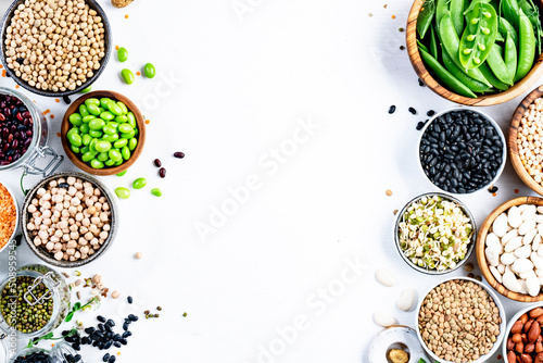 Beans, legumes and green sprouts. Dried, raw and fresh, top view. Red beans, lentils, chickpeas, soybeans. Healthy, nutritious, diet food, vegan protein, micronutrients and fiber sources