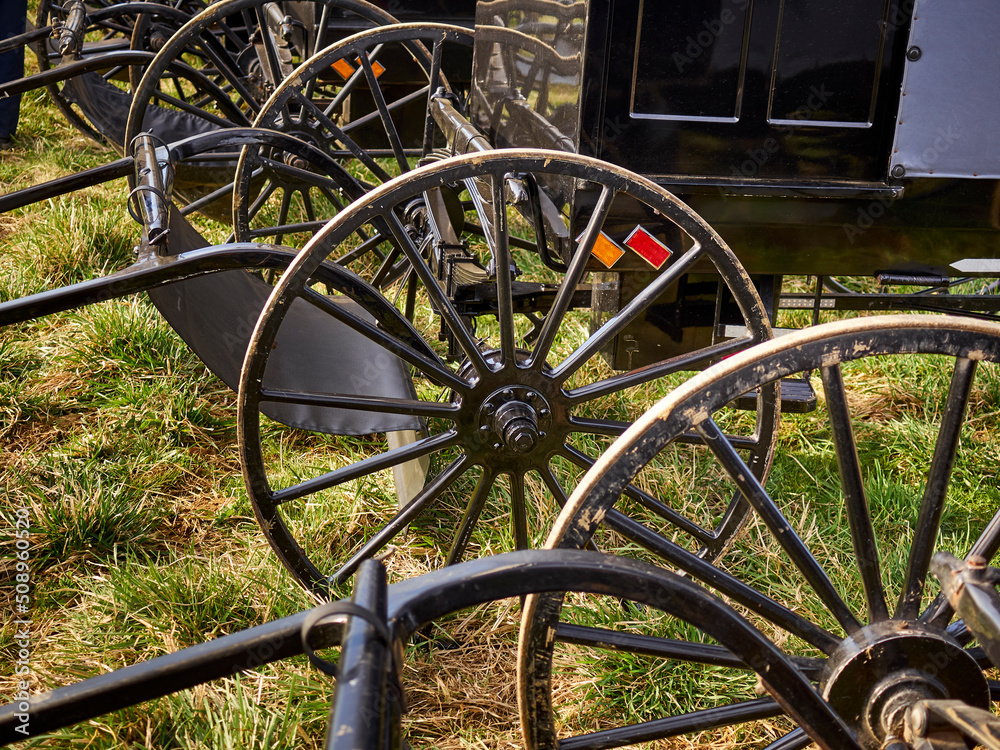 Wheels of Amish buggies parked at the Wakefield Mud Sale, Lancaster, PA, USA