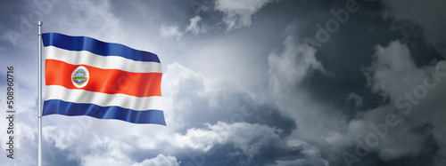 Tableau sur toile Costa Rican flag on a cloudy sky