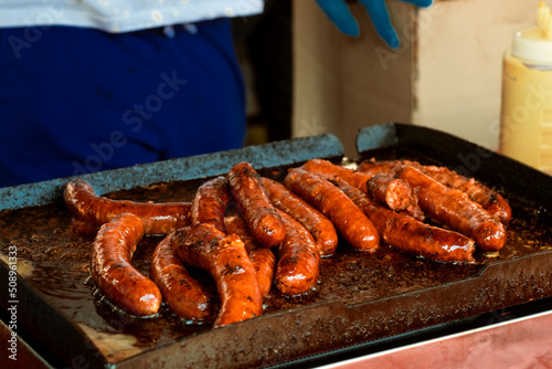 Traditional Serbian meat sausages - kobasice - on grill photo