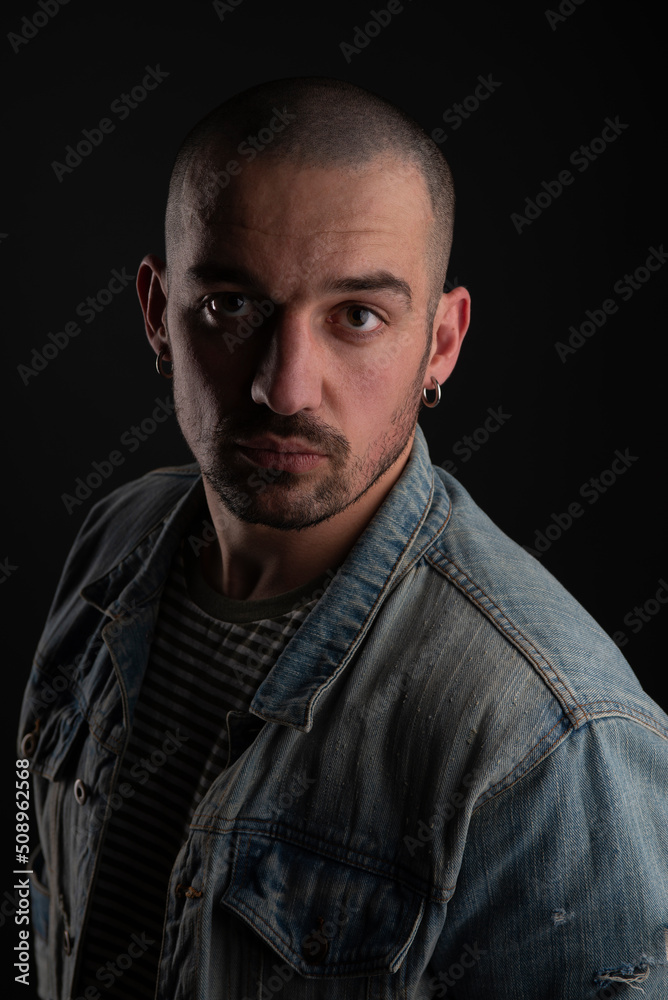 Cool bald bearded handsome man wearing denime jacket Cool bald bearded handsome man wearing denime jacket