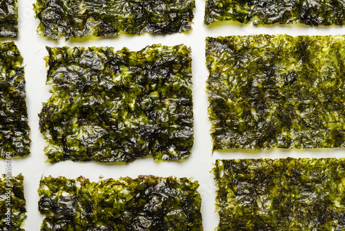 Tasty nori seaweed isolated on white.