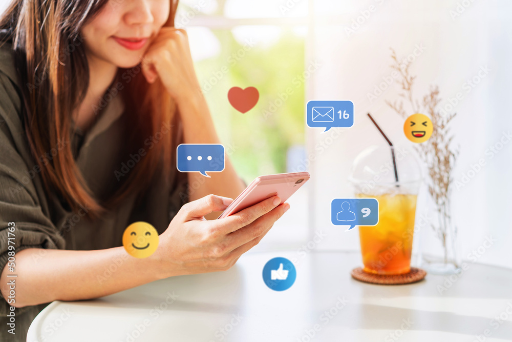 Young woman with drinks using mobile phone and relaxing in cafe, Modern lifestyle and social media concept. Young woman with drinks using mobile phone and relaxing in cafe, Modern lifestyle and social media concept.