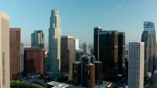 Cinematic urban aerial time lapse of downtown Los Angeles skyline.  Aerial of downtown Los Angeles in dawn, sunset in California, skyscrapers and office buildings, golden light.  Drone. 4K. 
