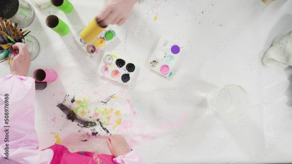 Flat lay. Kids papercraft. Painting empty toilet paper rolls with acrylic paint to create paper bugs. Flat lay. Kids papercraft. Painting empty toilet paper rolls with acrylic paint to create paper bugs.