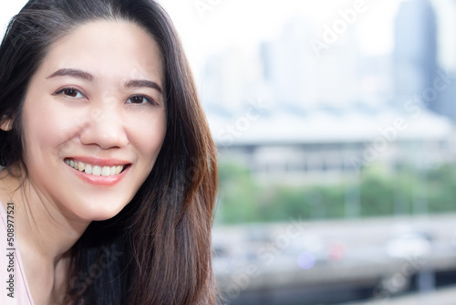 Asian beautiful woman looking to camera with smile and happiness on her leisure day Free Download Asian beautiful woman looking to camera with smile and happiness on her leisure day - GFXLoad
