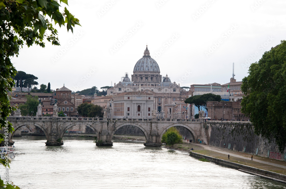 View at Ponte SantAngelo and Saint Peters Basilica from Tiber river in rome, Italy