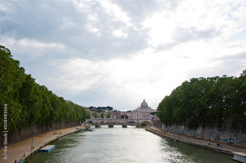 Fototapeta premium Tiber river waterfront with Ponte SantAngelo and Saint Peters Basilica on Rome cityscape in Italy