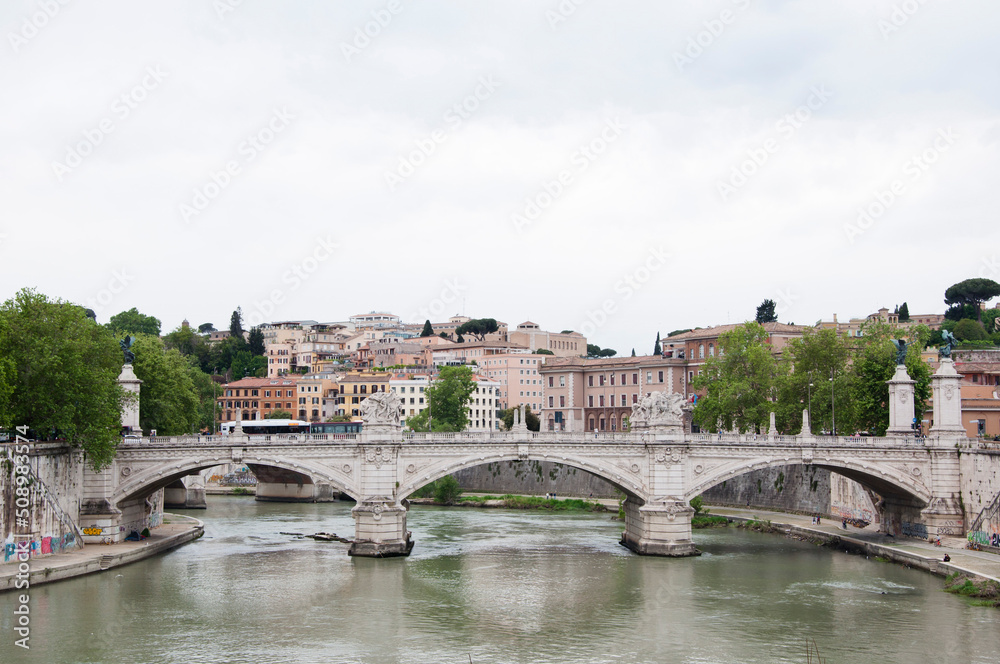 Ponte vittorio emanuele II bridge spanning over Tiber river on historic cityscape in Rome, Italy