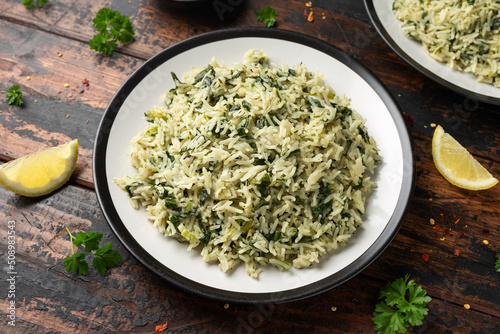 Spanakorizo, greek spinach rice. Healthy vegetarian food. photo