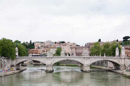 Ponte vittorio emanuele II bridge spanning over Tiber river on historic cityscape in Rome, Italy