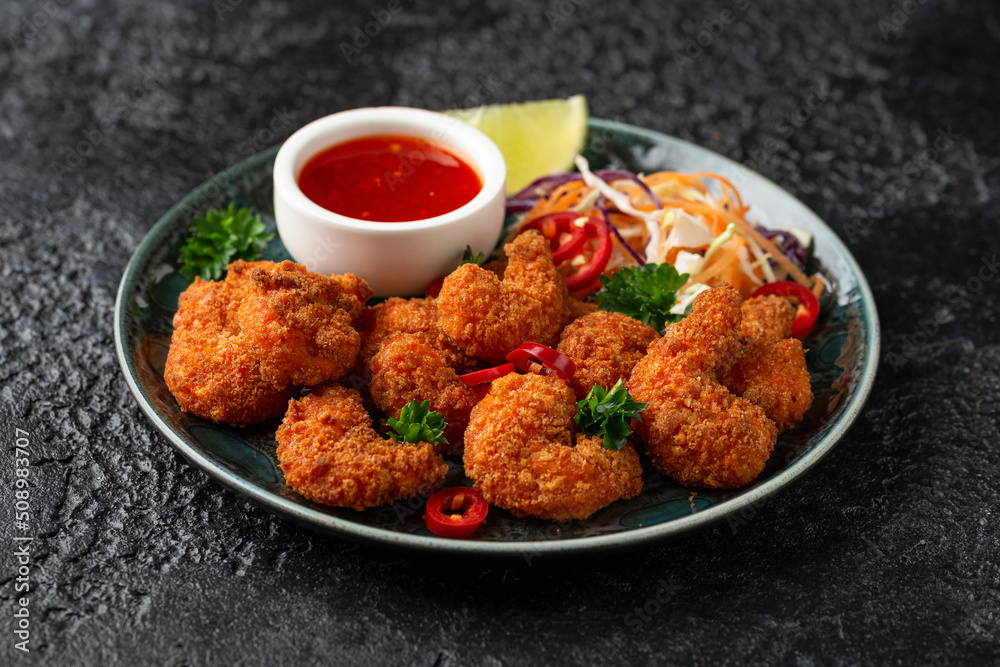 Crispy Prawns in breadcrumbs. Served with cabbage, carrot salad and soy and sweet chilli sauce Crispy Prawns in breadcrumbs. Served with cabbage, carrot salad and soy and sweet chilli sauce