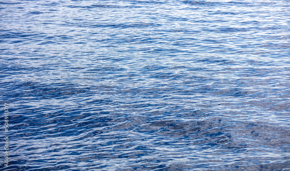 Sea water surface calm with small ripple. Still ocean, deep blue color ...