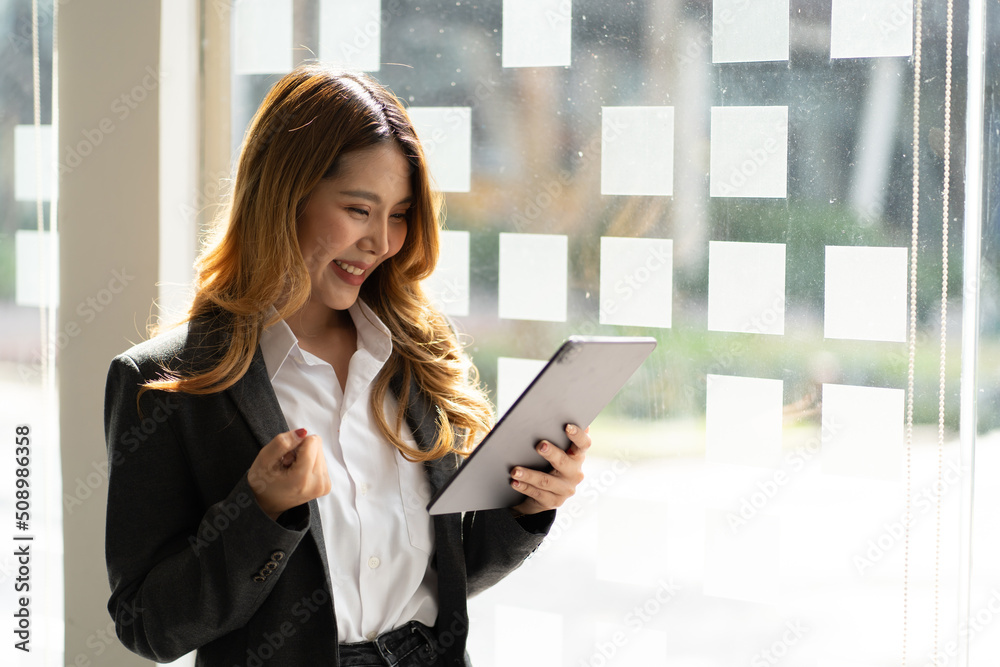 portrait of happy asian career woman using tablet pc. portrait of happy asian career woman using tablet pc.
