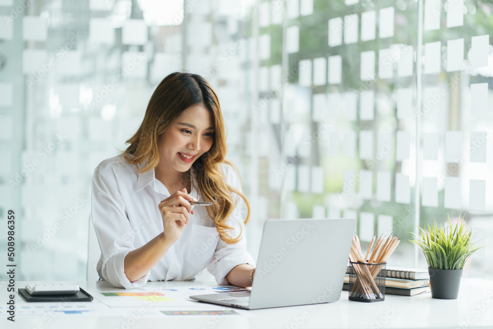 Portrait of smiling beautiful business asian woman working in office use computer with copy space. Business owner people sme freelance online marketing e-commerce telemarketing, work from home concept Portrait of smiling beautiful business asian woman working in office use computer with copy space. Business owner people sme freelance online marketing e-commerce telemarketing, work from home concept