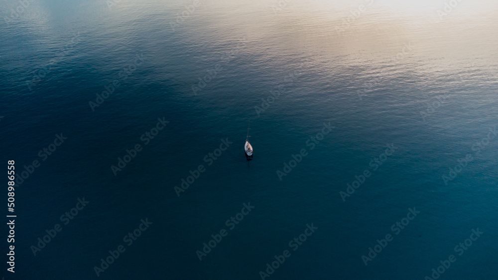 Ship in the sea. Drone aerial photography. Sea with crystal clear water.