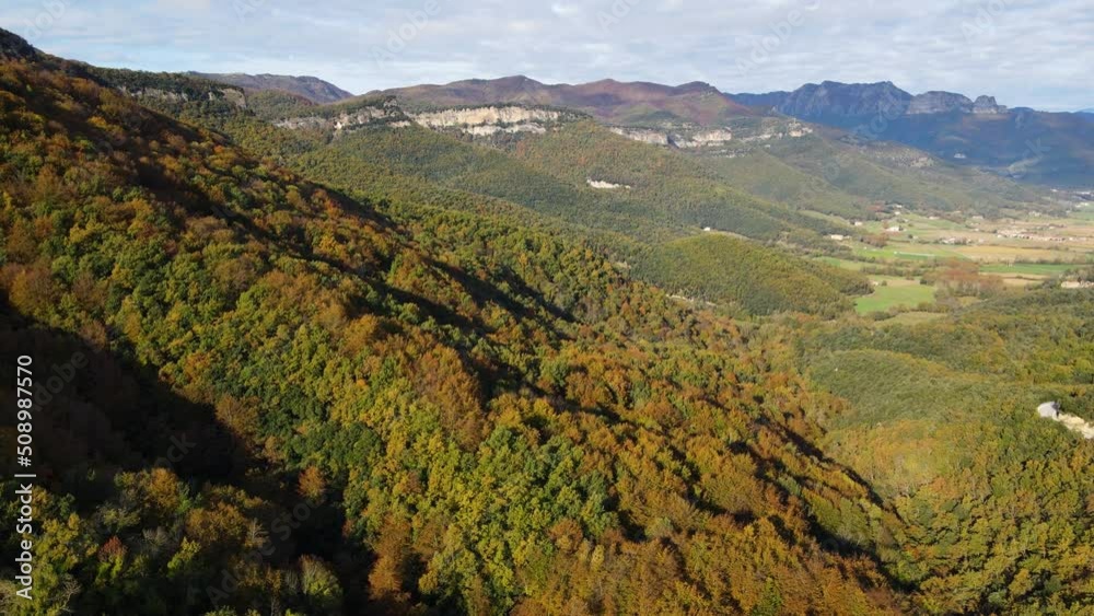 Aerial scene with drone of the autumn landscape in La Vall D En Bas, La Garrotxa, Girona, Spain. 4K UHD